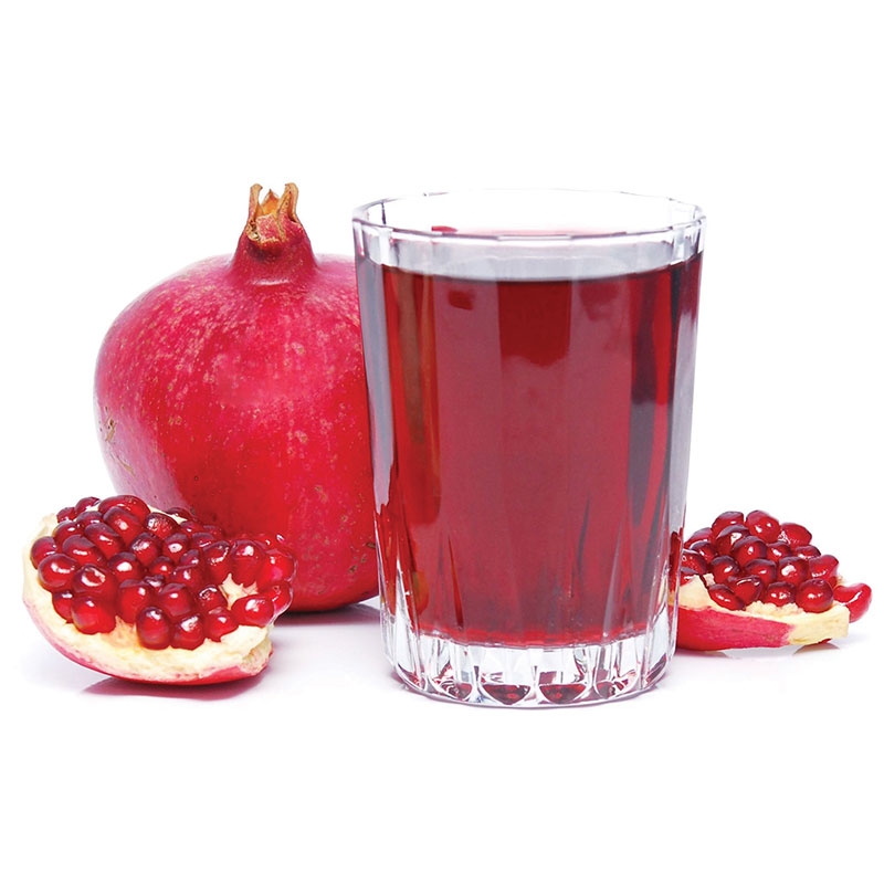 immagine dei Melograni Wonderful del mediterraneo e un bicchiere di succo di melograno